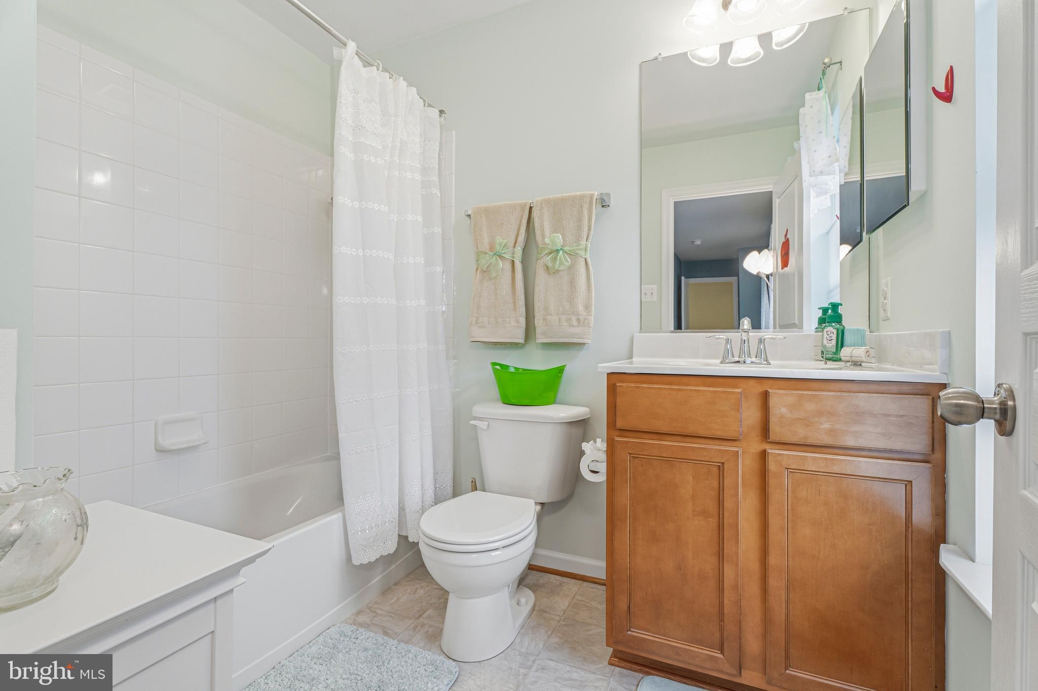 8876 Paddock Lane Baltimore, MD 21234 - Photo 28 of 37 a bathroom with a sink a toilet and shower