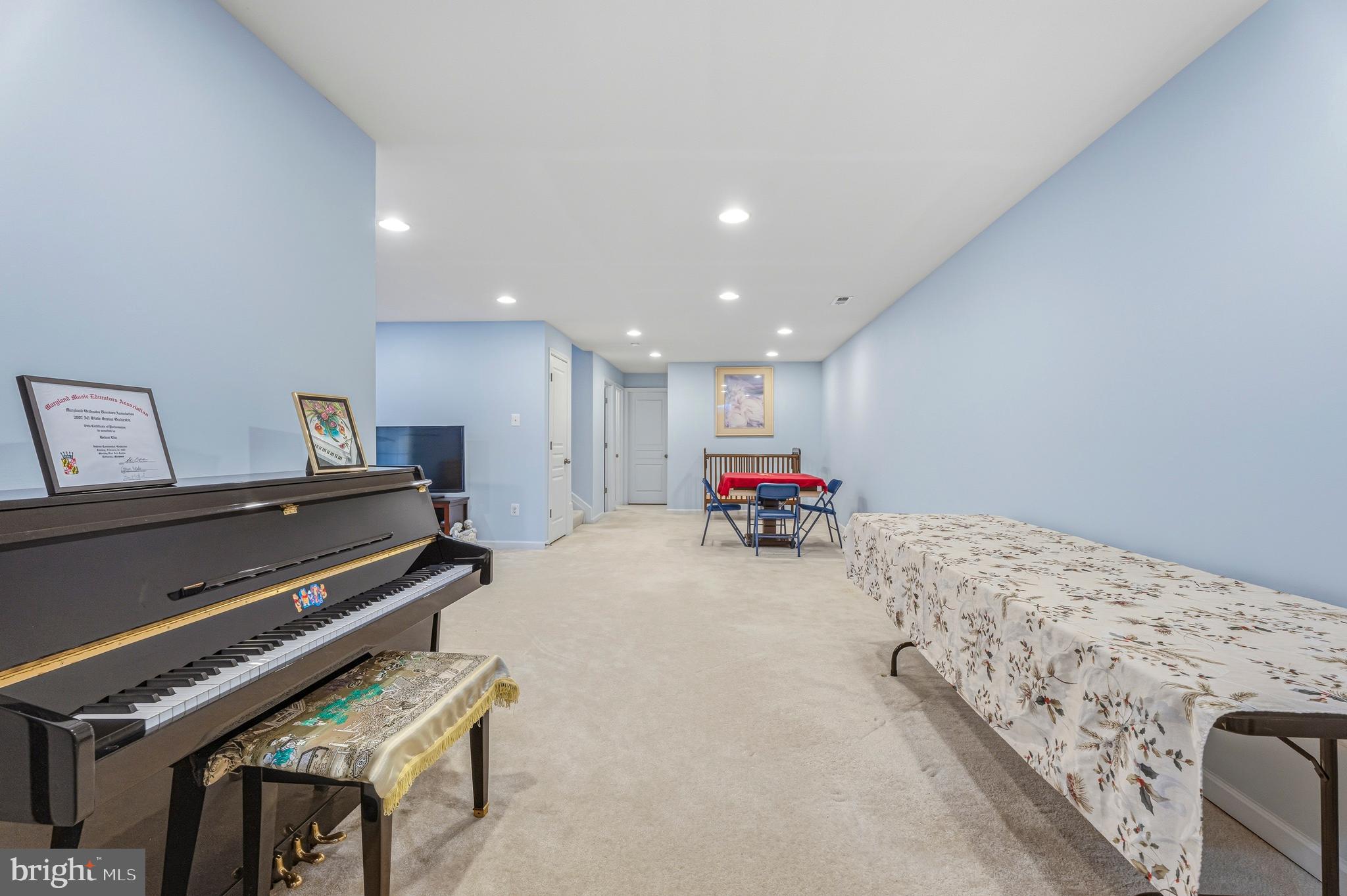 8876 Paddock Lane Baltimore, MD 21234 - Photo 32 of 37 a bed room with a bed and a piano