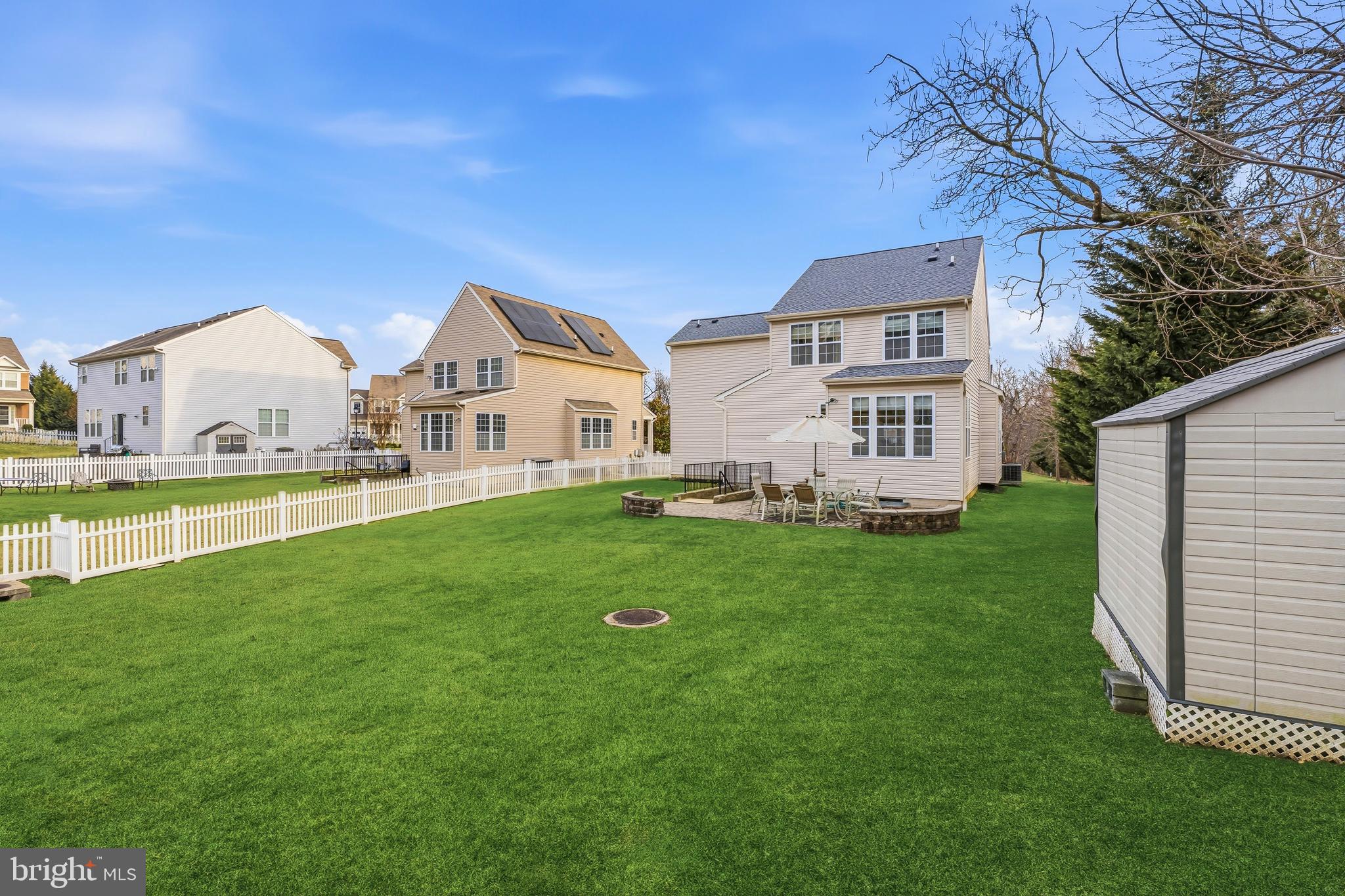 8876 Paddock Lane Baltimore, MD 21234 - Photo 34 of 37 a view of a house with a yard