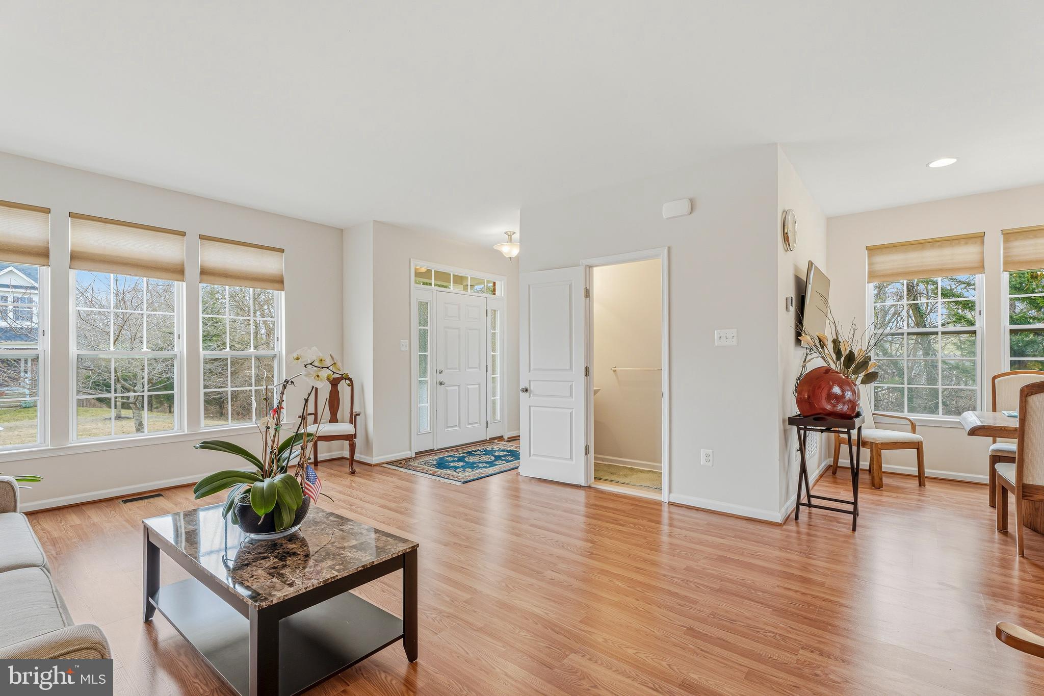 8876 Paddock Lane Baltimore, MD 21234 - Photo 5 of 37 a living room with furniture large window and wooden floor