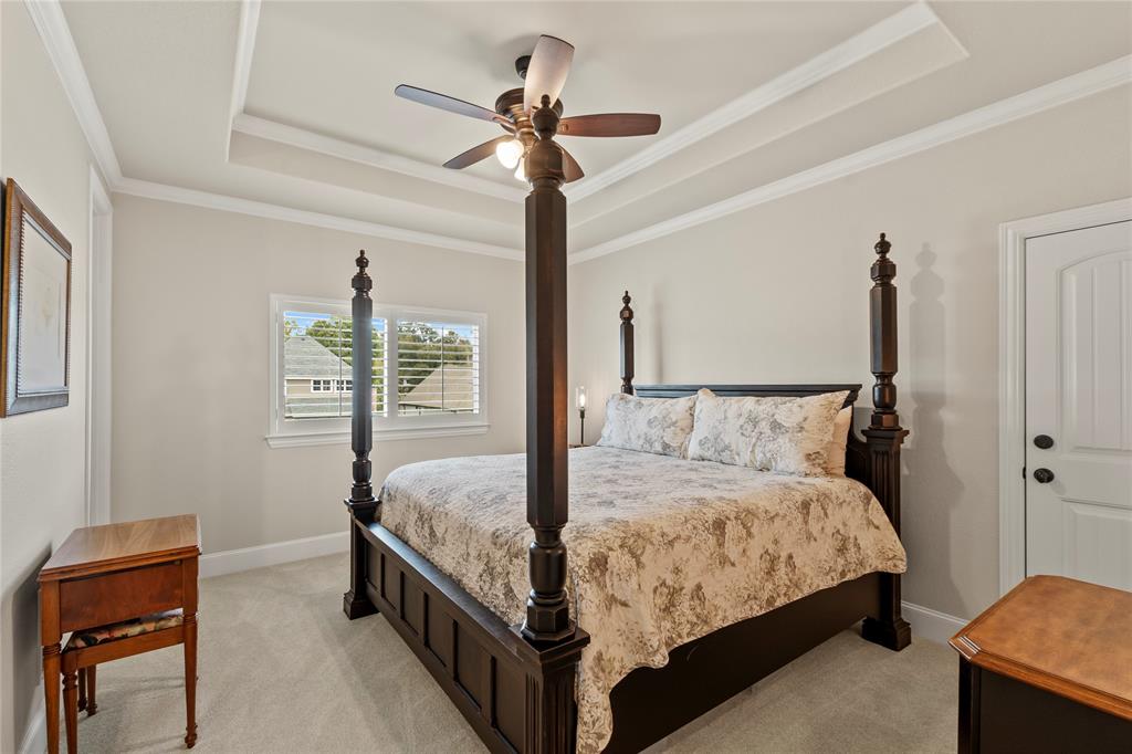 111 St Annes Mabank, TX 75156 - Photo 18 of 40 a bedroom with a bed and a chandelier