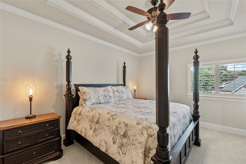 111 St Annes Mabank, TX 75156 - Photo 21 of 40 a bedroom with a bed and a chandelier