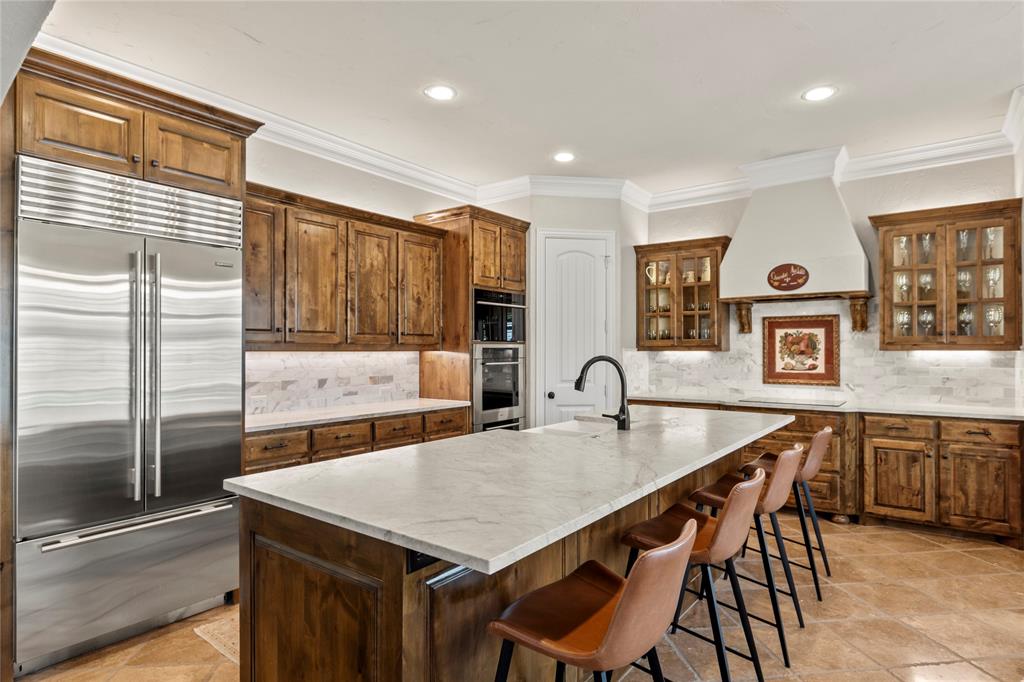 111 St Annes Mabank, TX 75156 - Photo 8 of 40 a kitchen with a table chairs and refrigerator