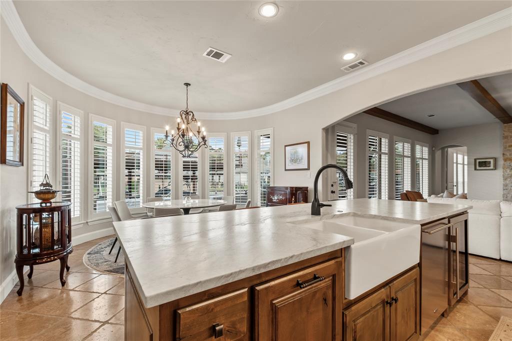 111 St Annes Mabank, TX 75156 - Photo 9 of 40 a large kitchen with kitchen island a large counter space dining table and stainless steel appliances