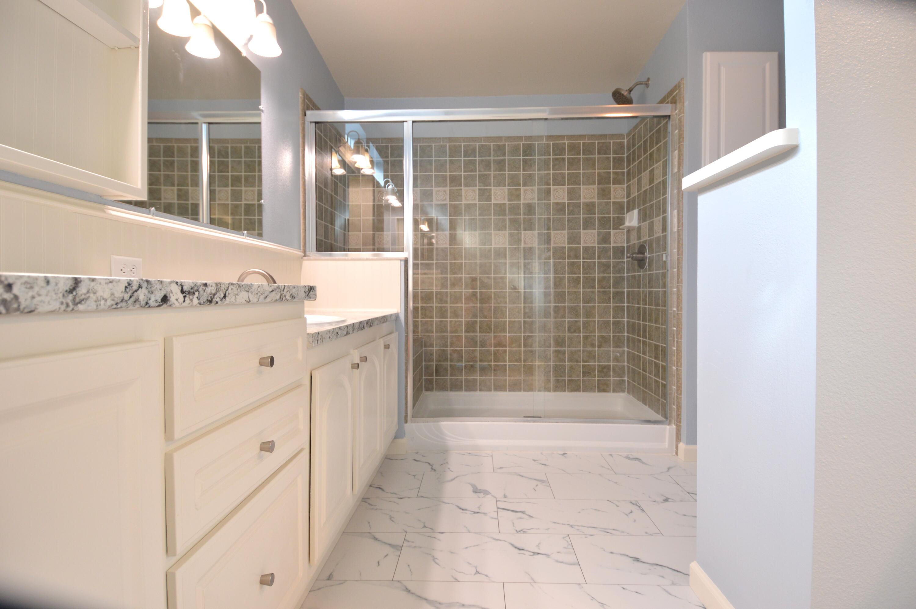 1201 Southwest Sunshine Street Stuart, FL 34997 - Photo 21 of 41 a bathroom with a shower