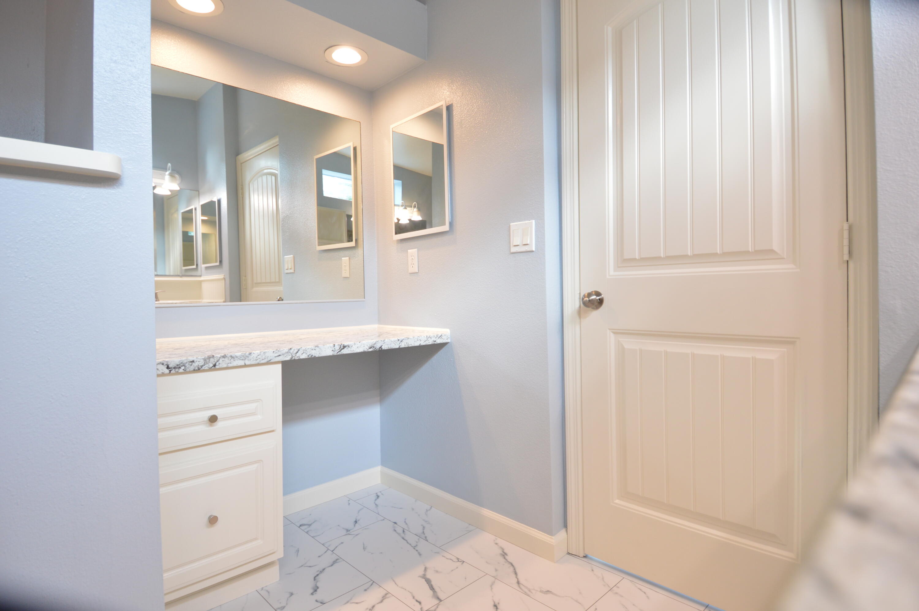 1201 Southwest Sunshine Street Stuart, FL 34997 - Photo 22 of 41 a bathroom with a sink and a mirror