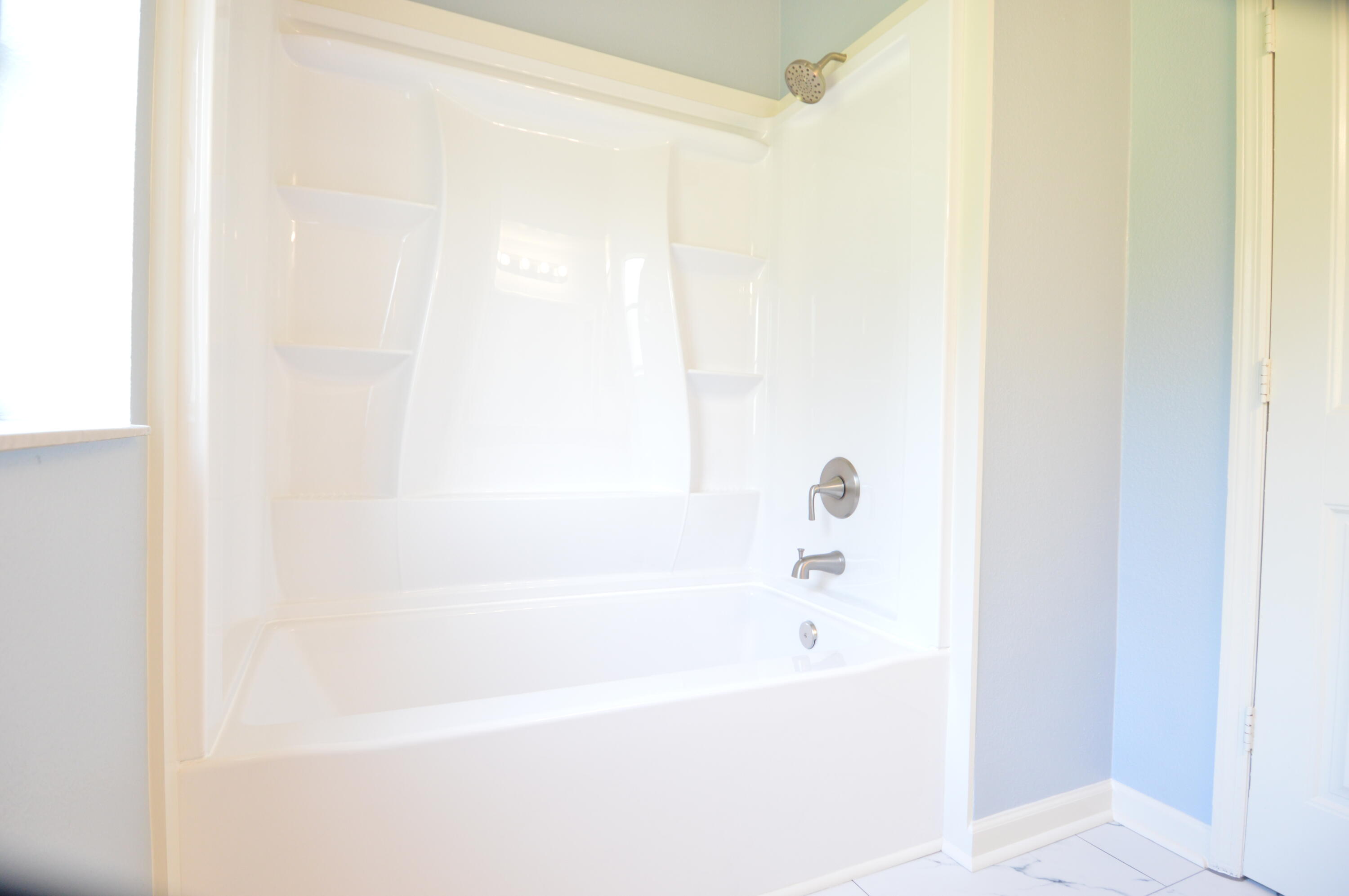 1201 Southwest Sunshine Street Stuart, FL 34997 - Photo 29 of 41 a white bath tub sitting next to a white sink