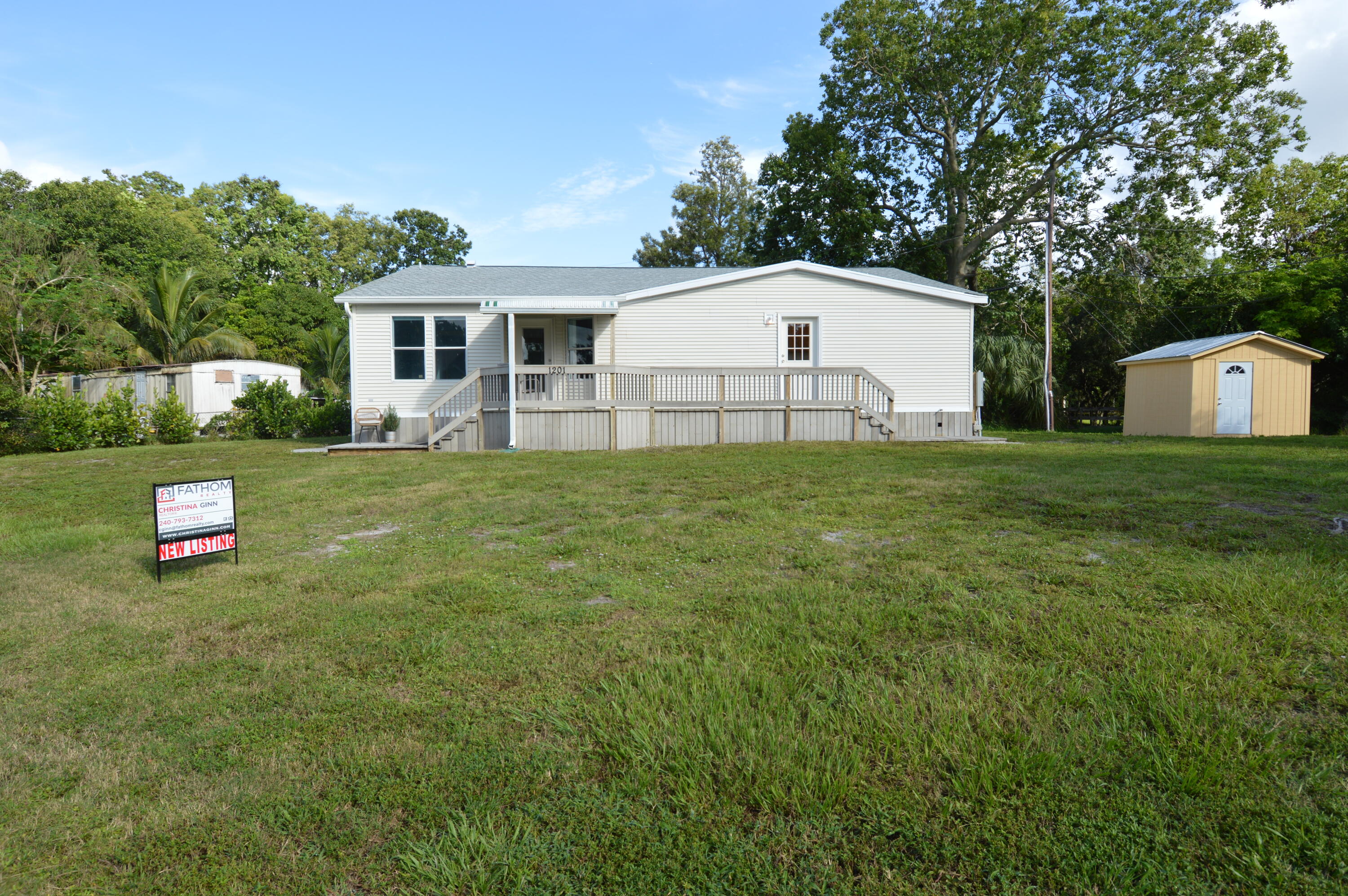 1201 Southwest Sunshine Street Stuart, FL 34997 - Photo 31 of 41 a view of a backyard of the house