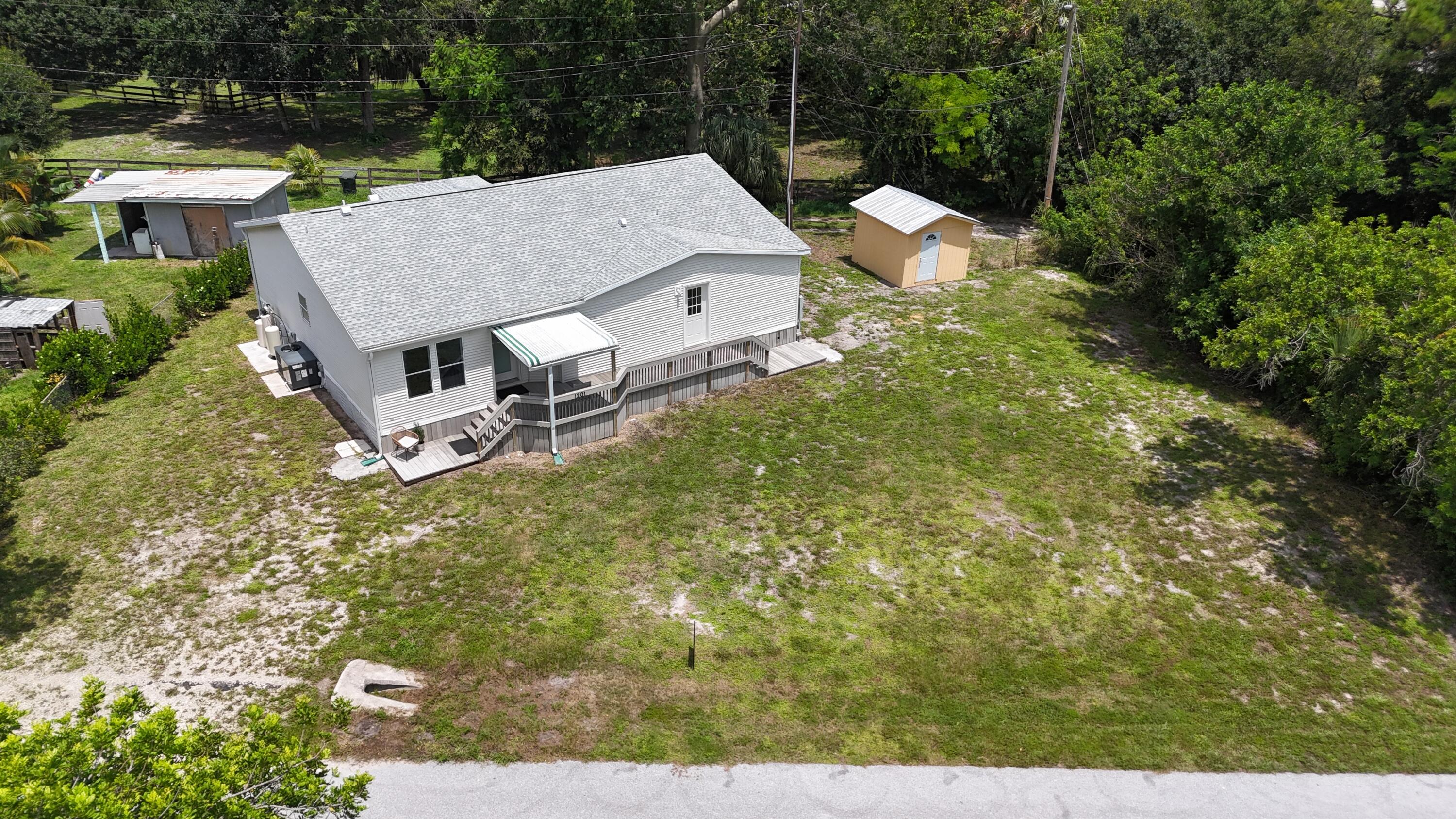 1201 Southwest Sunshine Street Stuart, FL 34997 - Photo 38 of 41 an aerial view of a house with a yard