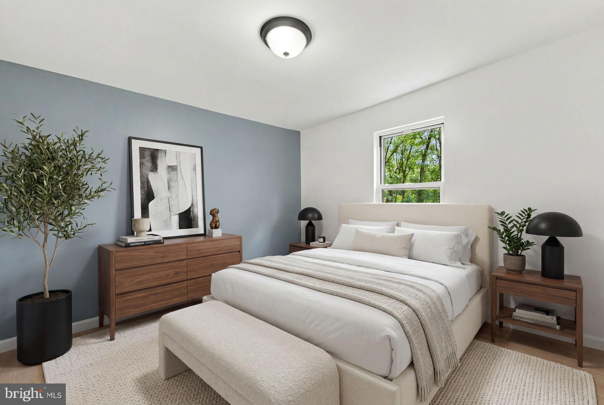 185 Rancocas Road Mount Holly, NJ 08060 - Photo 21 of 34 a bedroom with a bed and a potted plant