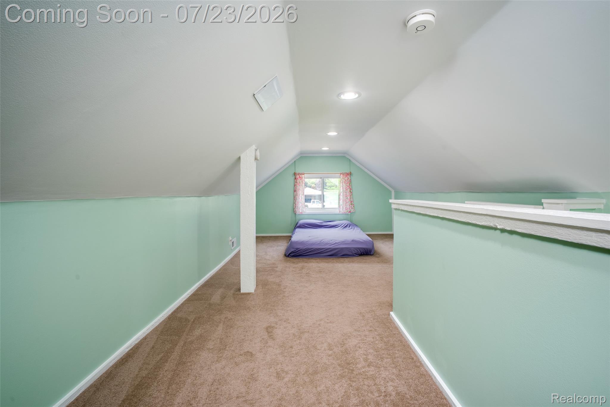 829 Francis Street Rochester, MI 48307 - Photo 15 of 25 Attic living space featuring sloped ceilings, recessed lighting, neutral carpet flooring, and light green wall paint
