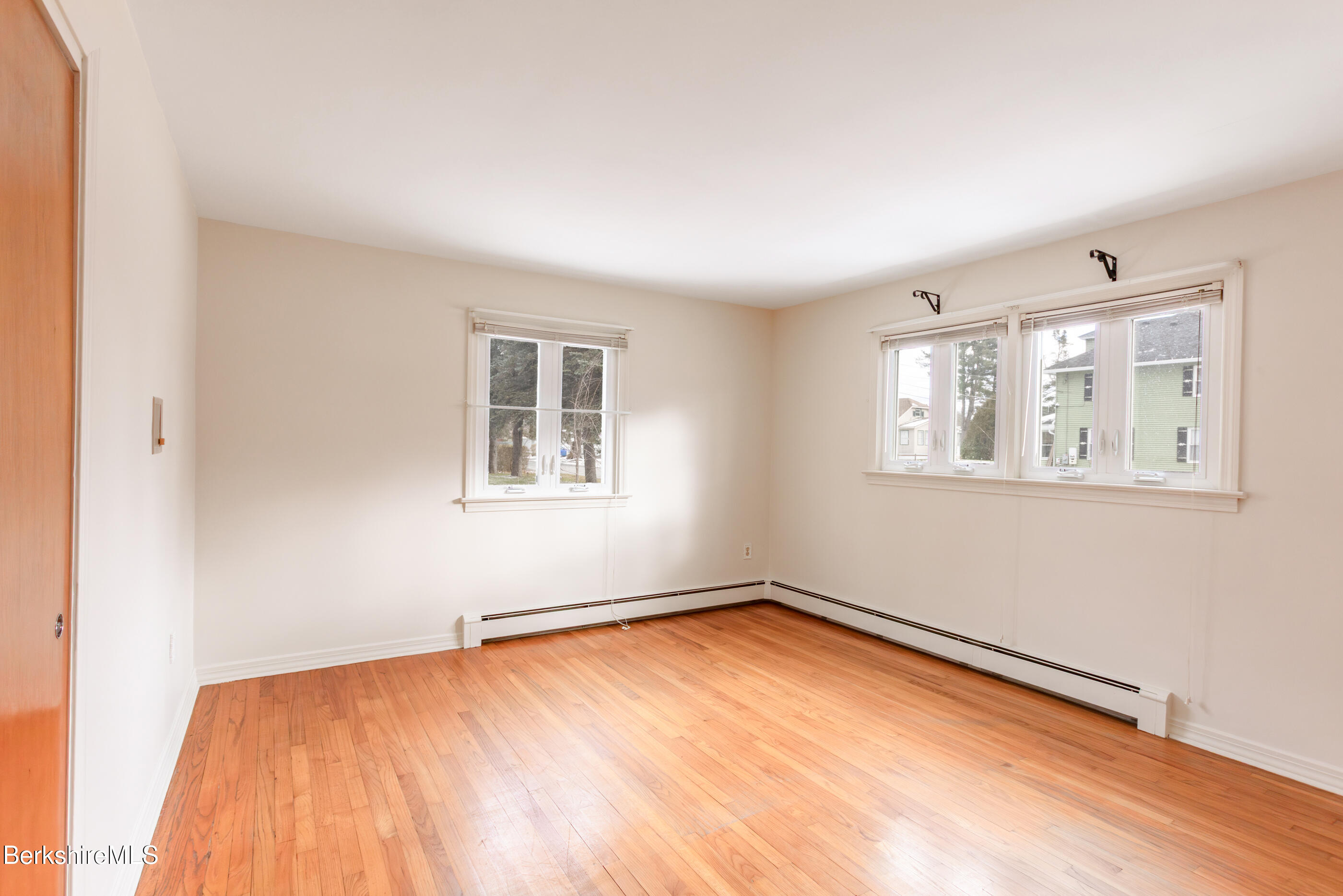 25 Robert Street Pittsfield, MA 01201 - Photo 11 of 19 a view of empty room with wooden floor and fan