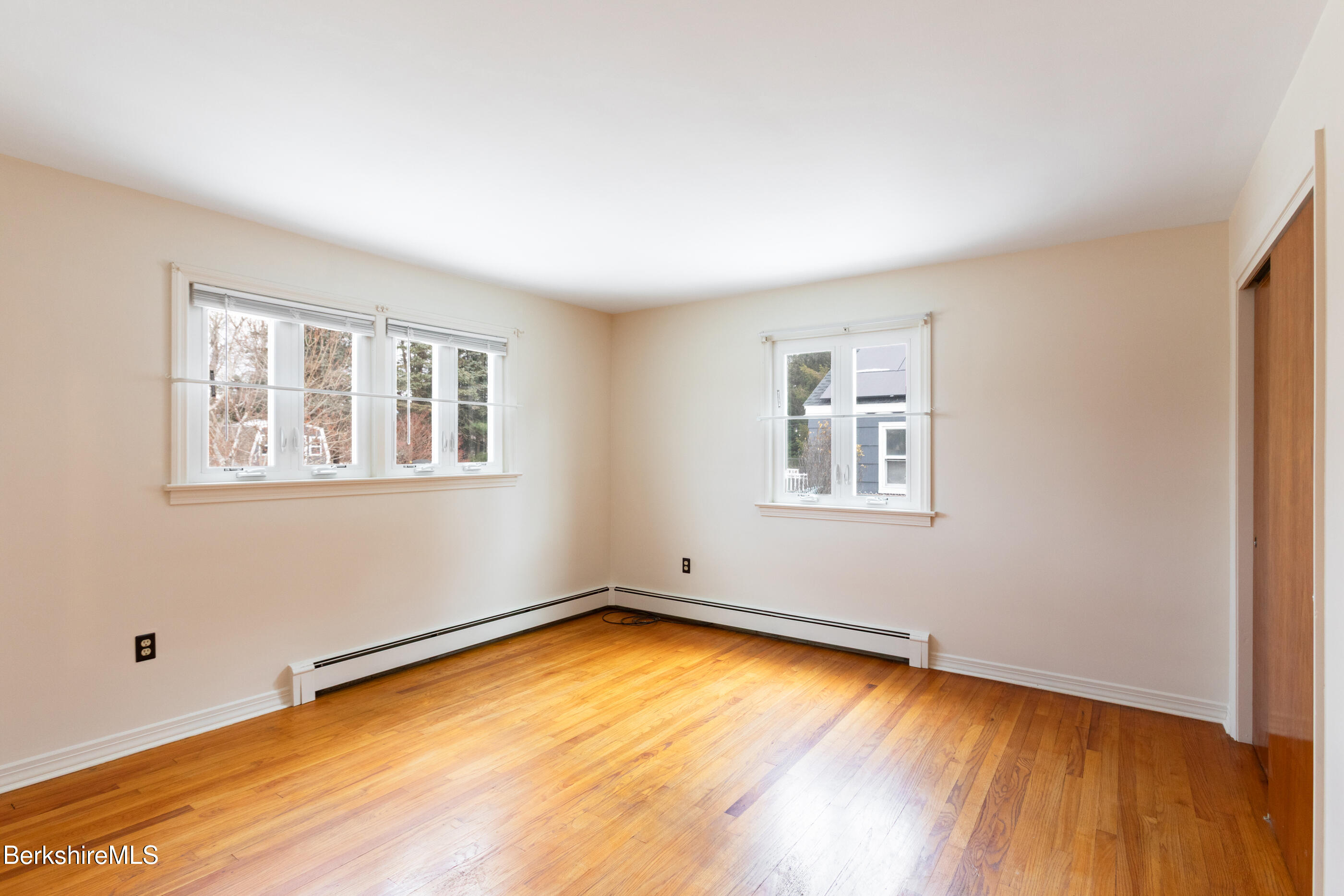25 Robert Street Pittsfield, MA 01201 - Photo 13 of 19 a view of an empty room with a window and wooden floor