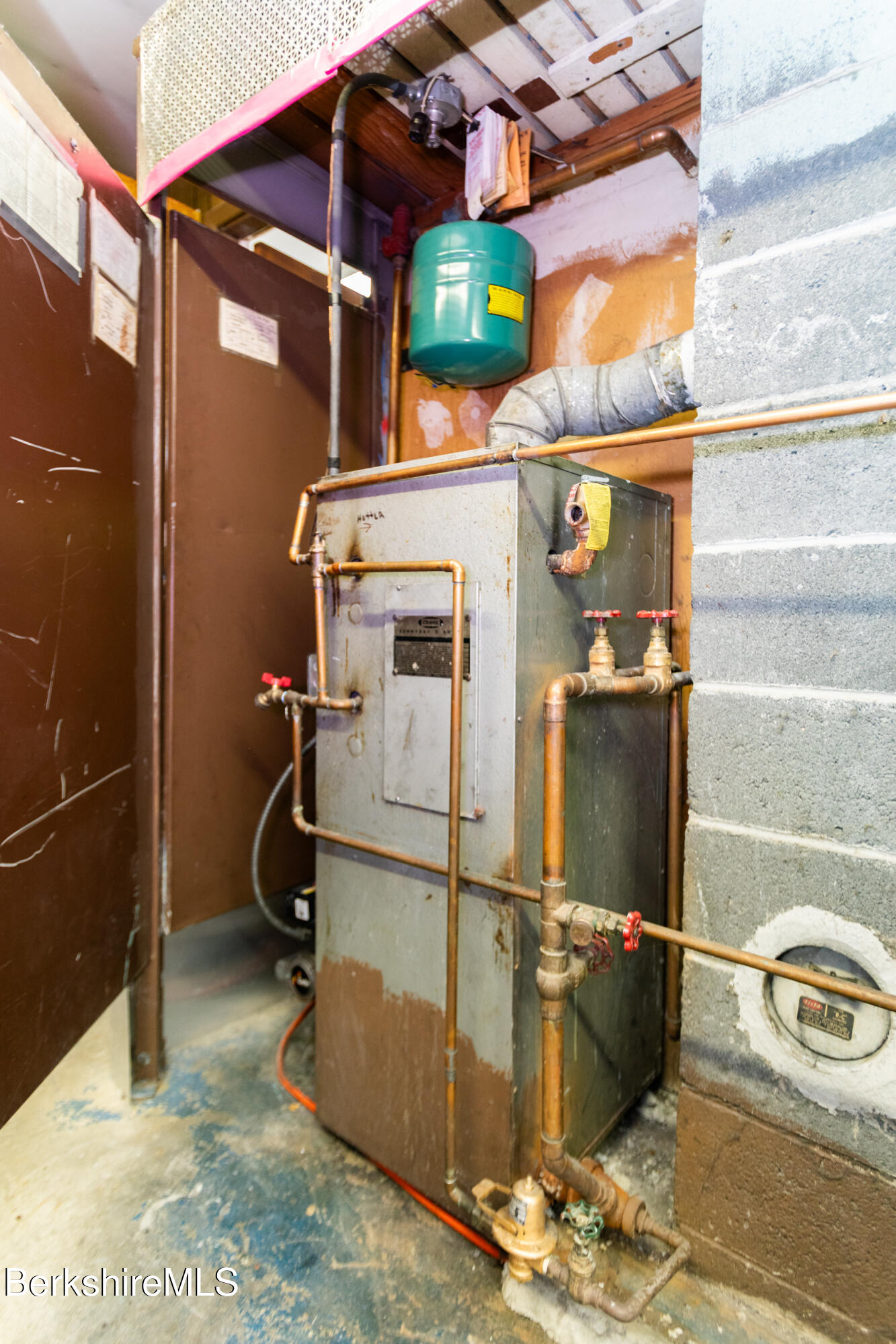 25 Robert Street Pittsfield, MA 01201 - Photo 19 of 19 a storage room with washer and dryer