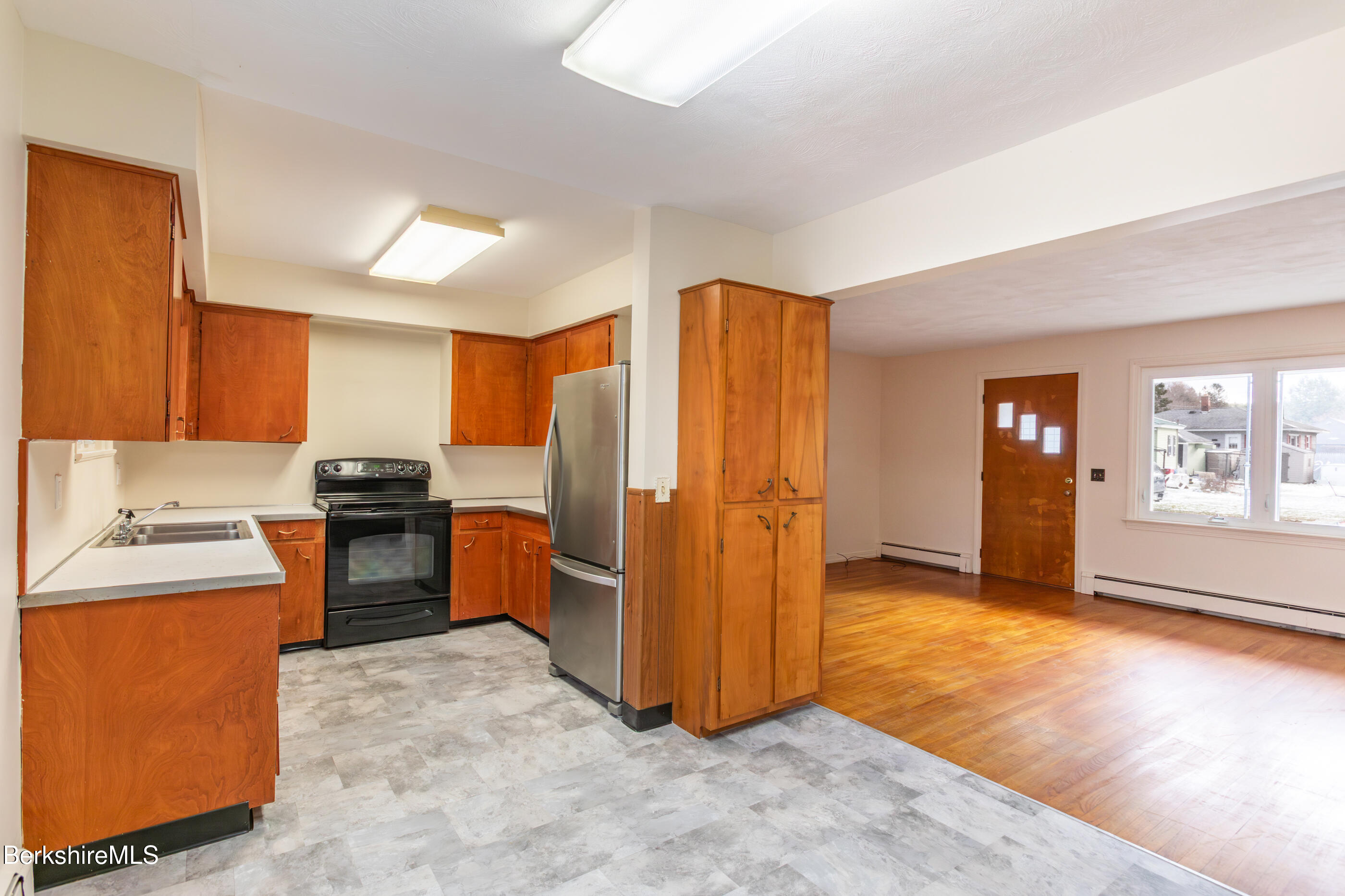 25 Robert Street Pittsfield, MA 01201 - Photo 7 of 19 a view of a kitchen with refrigerator and cabinets