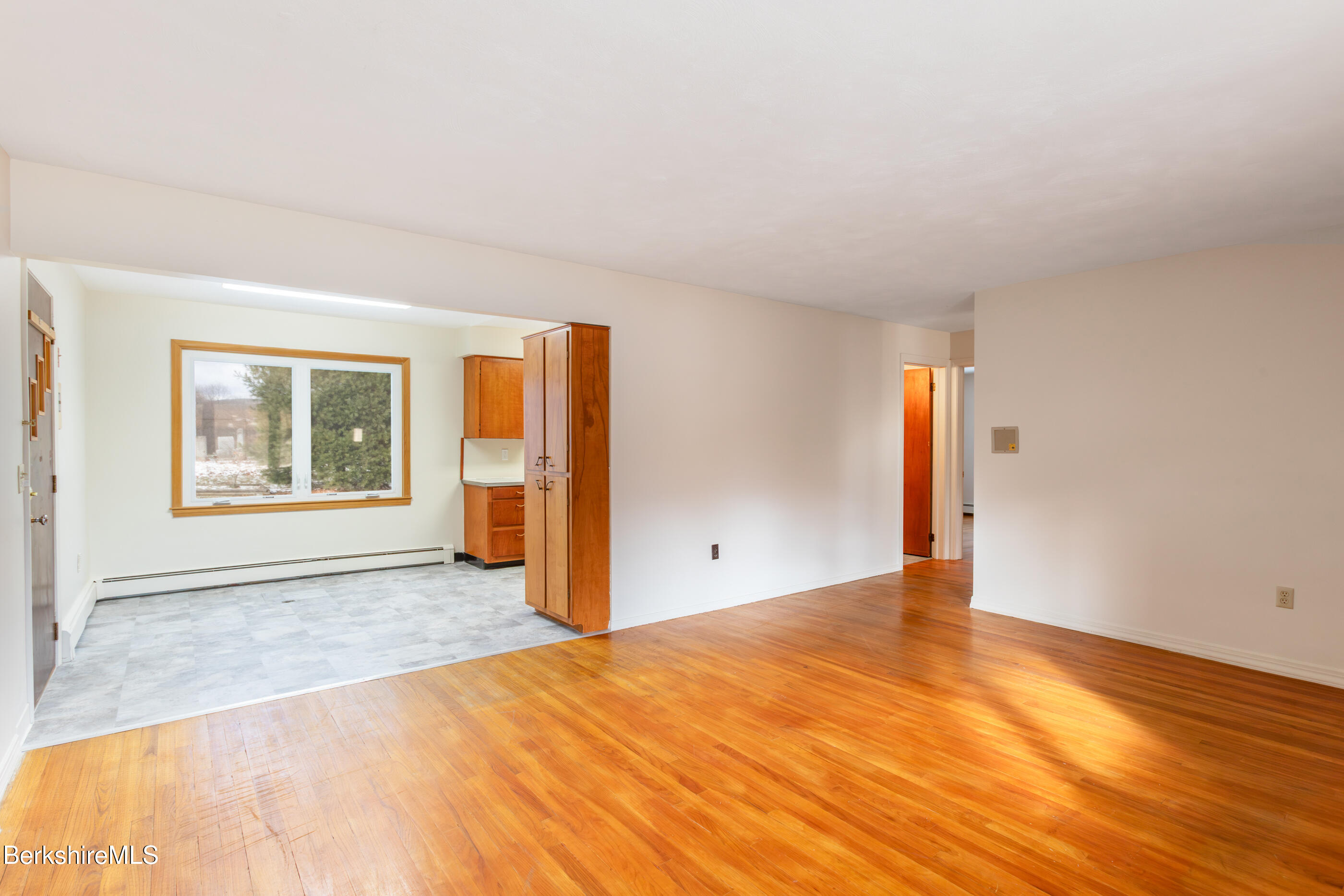 25 Robert Street Pittsfield, MA 01201 - Photo 9 of 19 a view of an empty room with window and wooden floor