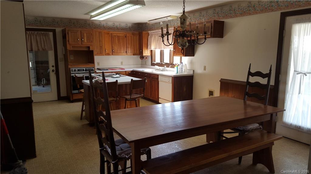13531 Cabarrus Station Road Midland, NC 28107 - Photo 5 of 14 a view of kitchen and dining room with windows