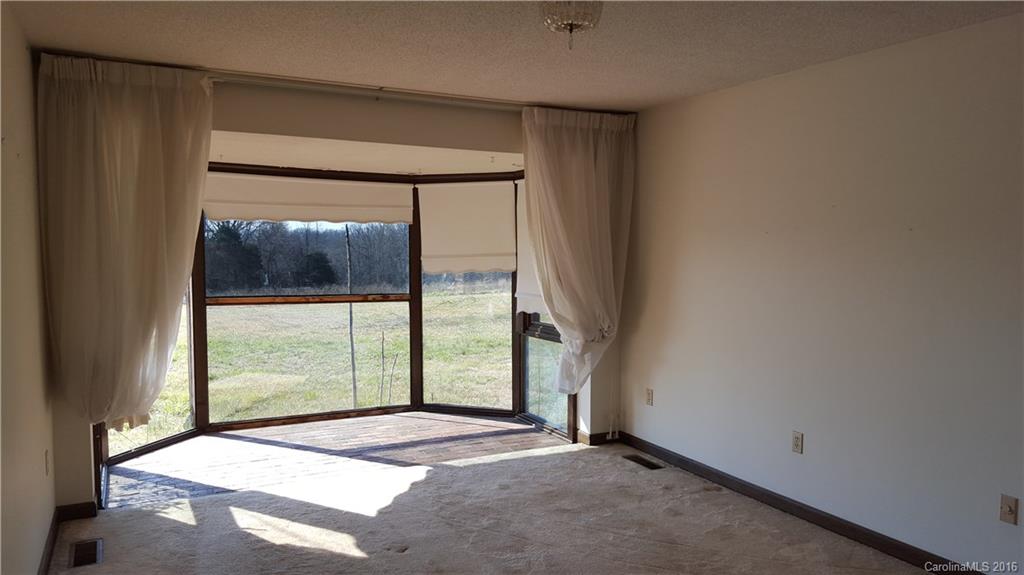 13531 Cabarrus Station Road Midland, NC 28107 - Photo 9 of 14 a view of an empty room with a window