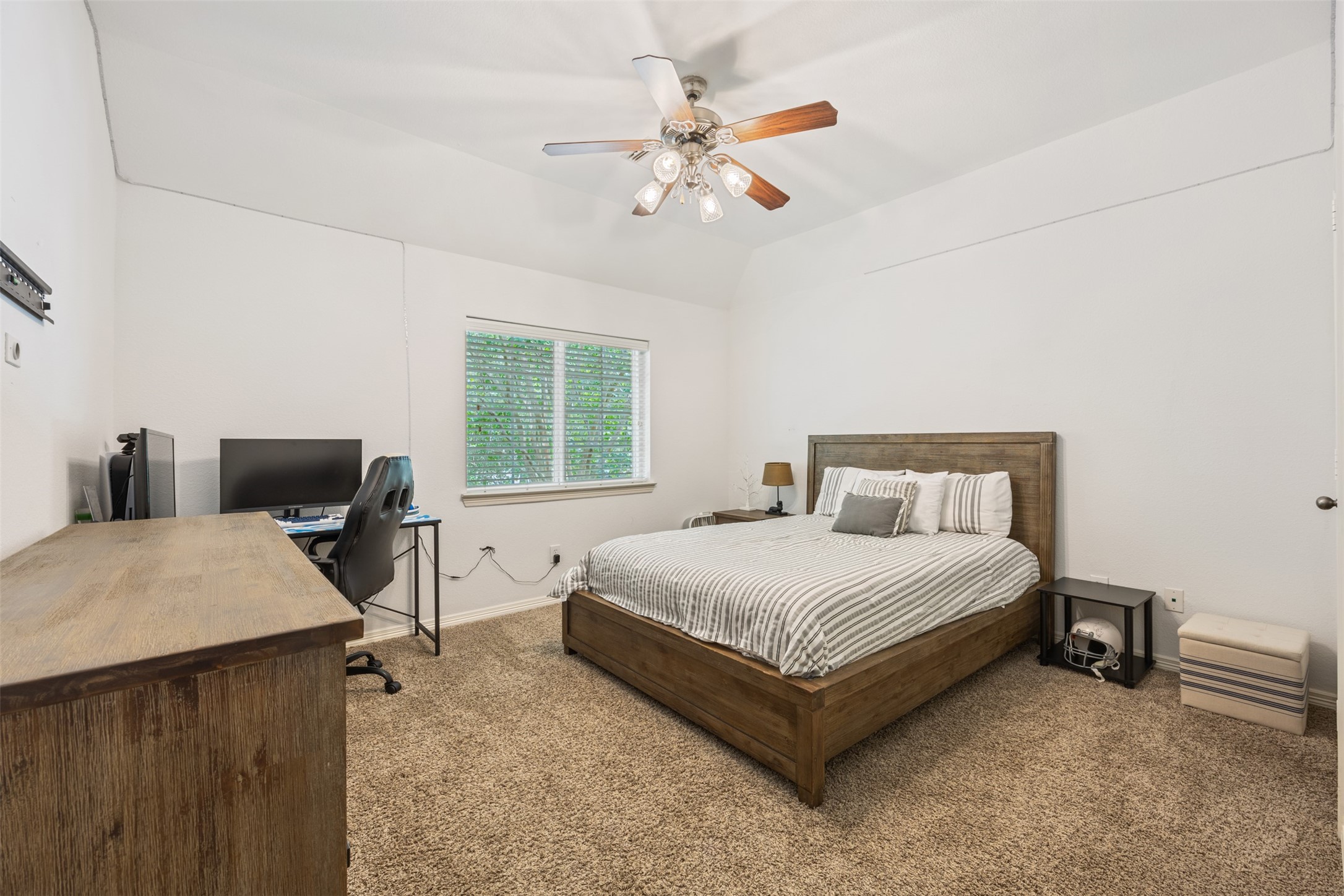 58 South Longsford Circle Spring, TX 77382 - Photo 13 of 50 a bedroom with a bed and a chandelier