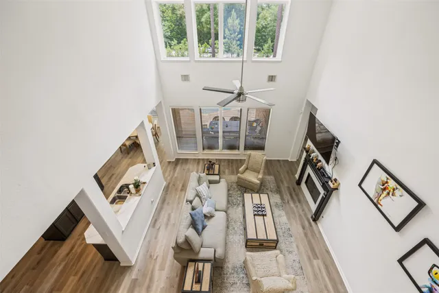 a view of a living room with furniture and a large window