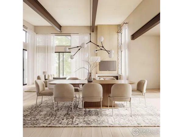a living room with couches chairs and large mirror with wooden floor