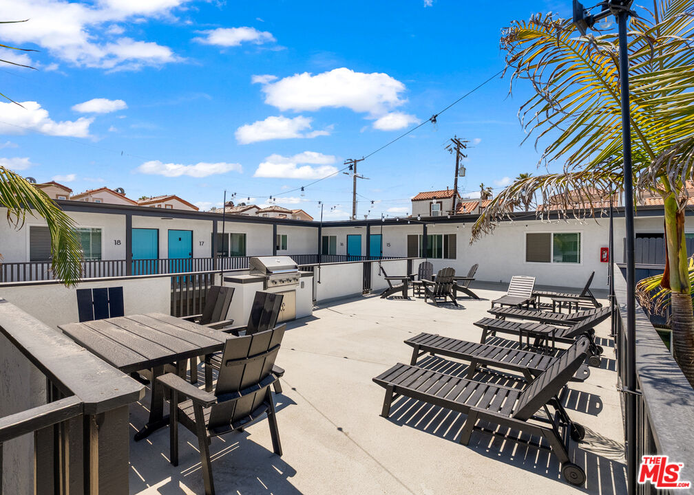 125 16th Street Huntington Beach, CA 92648 - Photo 2 of 10 a view of a patio with couches table and chairs