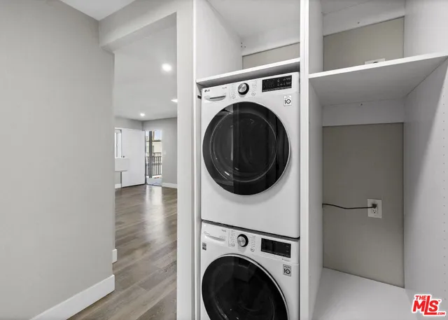 a view of a hallway with washer and dryer