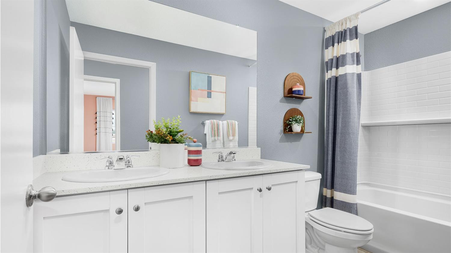 2488 Labrusca Street Manteca, CA 95337 - Photo 15 of 17 a bathroom with a sink a toilet and shower