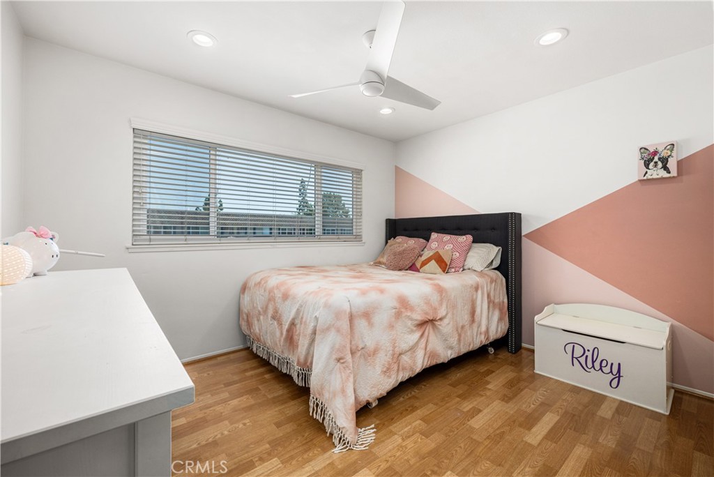 4237 Larwin Avenue Cypress, CA 90630 - Photo 30 of 48 a bedroom with a bed and a table