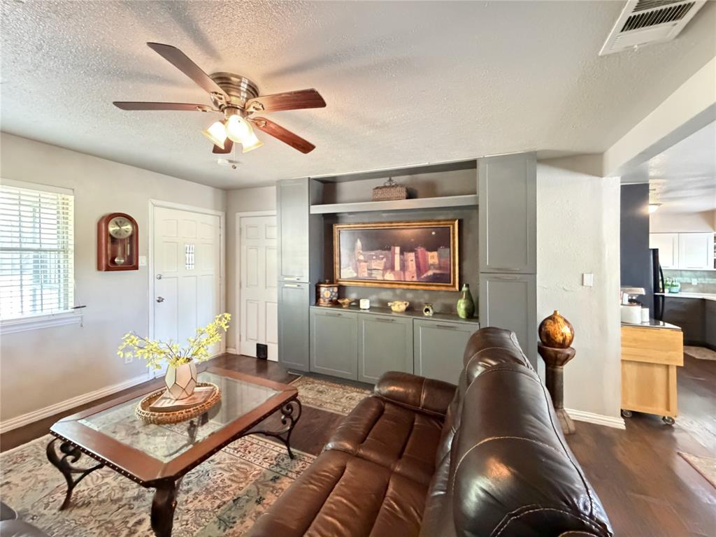 2243 Inca Drive Dallas, TX 75216 - Photo 3 of 24 The inviting living area featuring custom built-ins.
