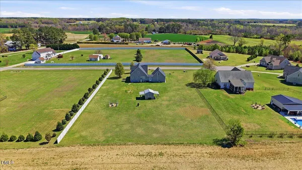 a view of yard with swimming pool and outdoor seating