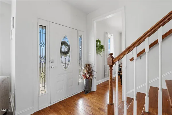 a view of entryway with wooden floor