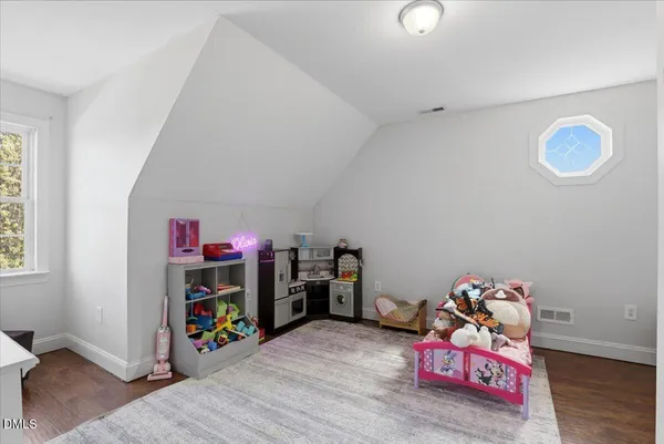 a bed room with a bed and a window