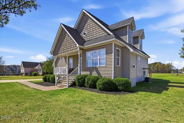 a front view of a house with garden