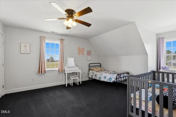 a bed room with a bed and a window