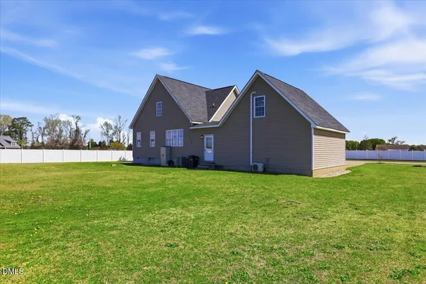a backyard of a house with lots of green space