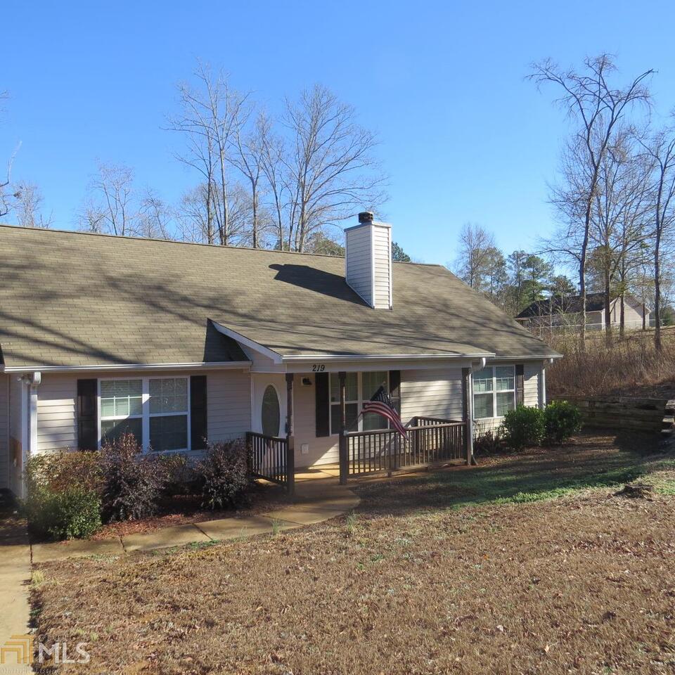 219 Bradley Road Jackson, GA 30233 - Photo 1 of 1 a front view of a house with garden