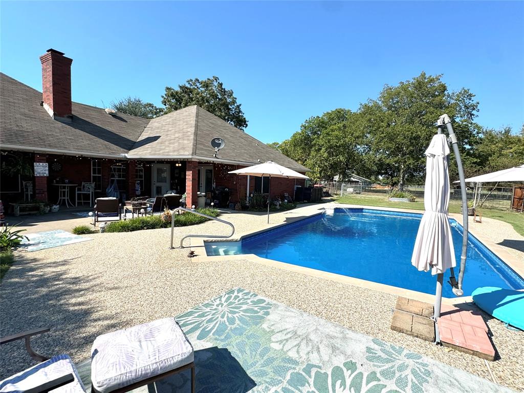 505 3rd Street Dodd City, TX 75438 - Photo 13 of 37 a swimming pool with outdoor seating