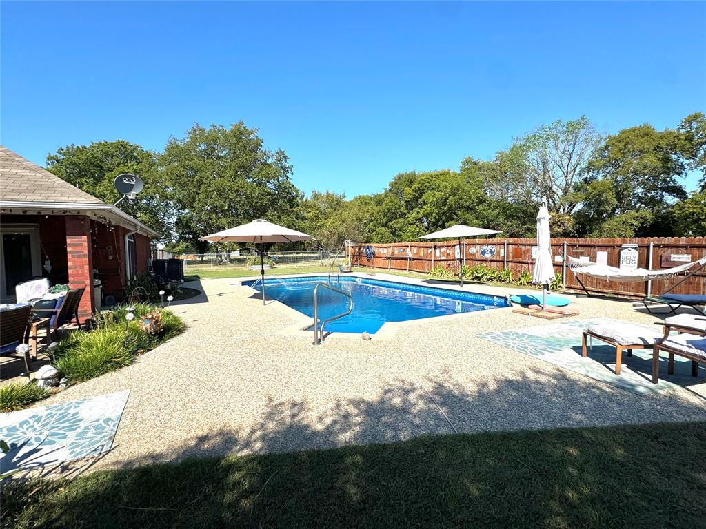505 3rd Street Dodd City, TX 75438 - Photo 14 of 37 a view of a swimming pool with a patio