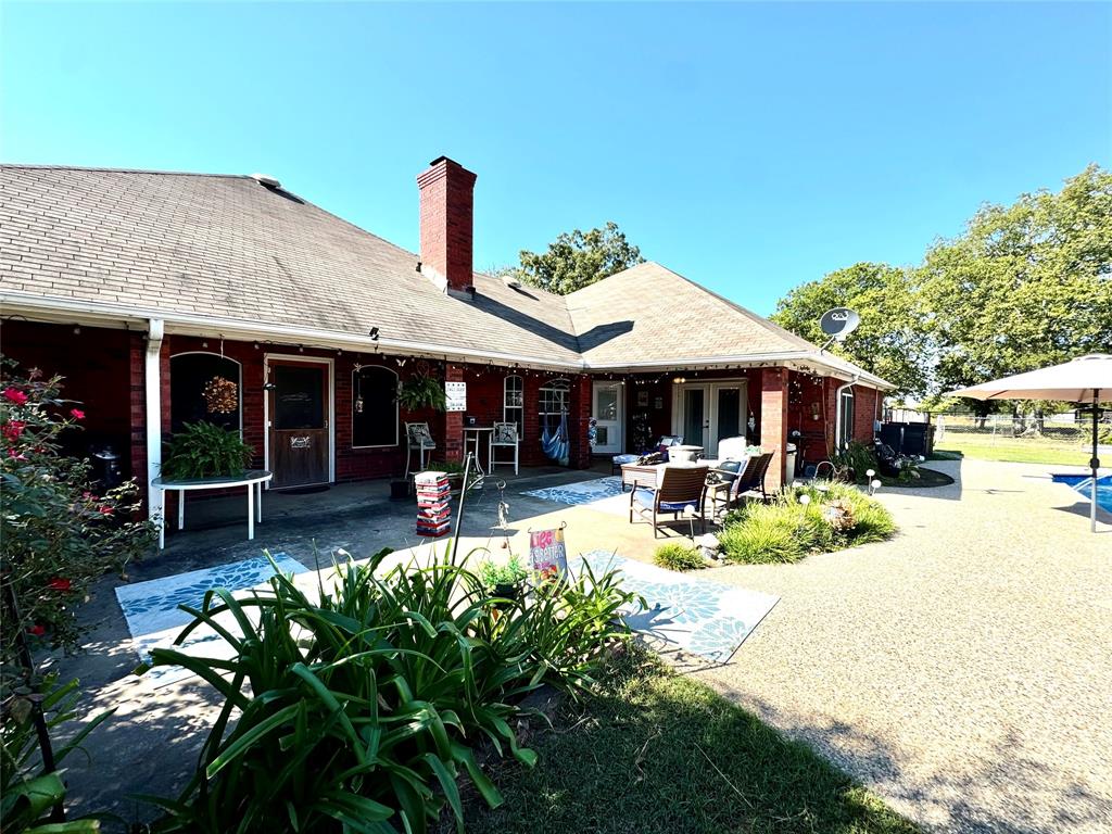 505 3rd Street Dodd City, TX 75438 - Photo 15 of 37 a front view of a house with sitting area and garden