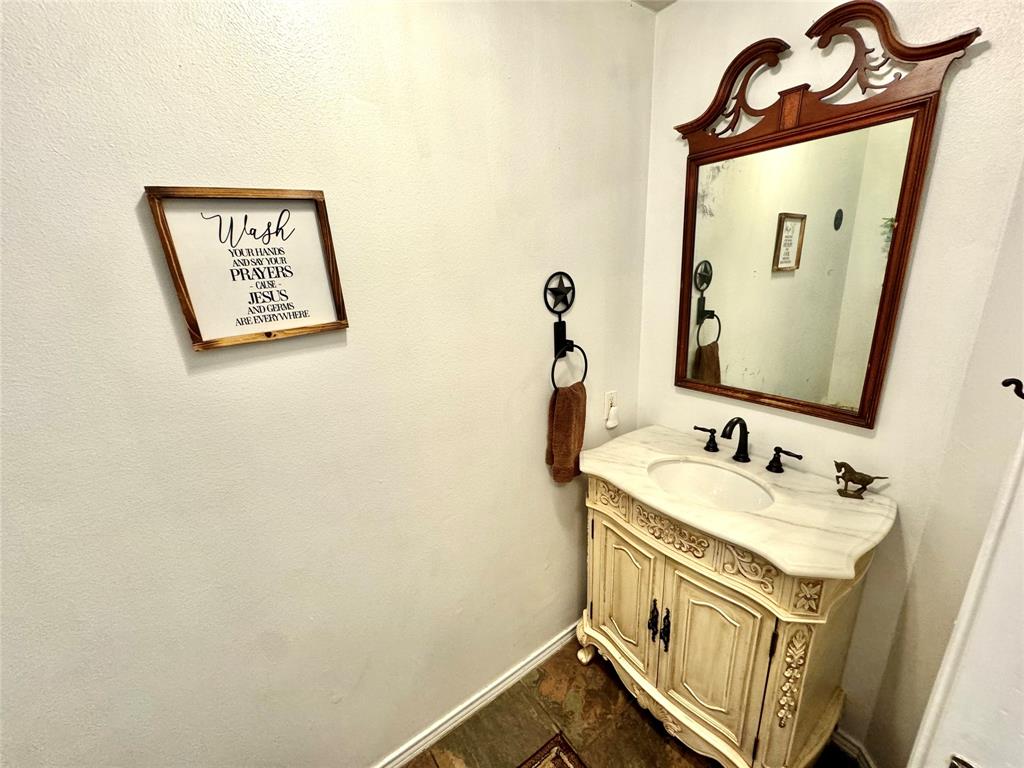 505 3rd Street Dodd City, TX 75438 - Photo 23 of 37 a bathroom with a sink and a mirror