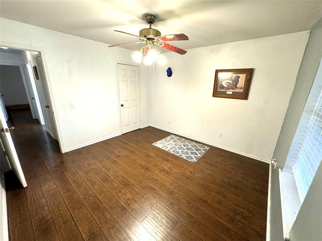 505 3rd Street Dodd City, TX 75438 - Photo 35 of 37 a view of a big room with wooden floor and ceiling fan