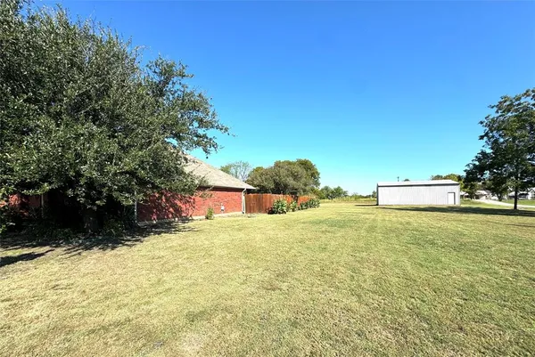 a view of yard with swimming pool