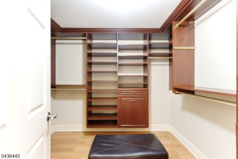 4 Windemere Way Sparta, NJ 07871 - Photo 37 of 50 a view of walk in closet with empty racks