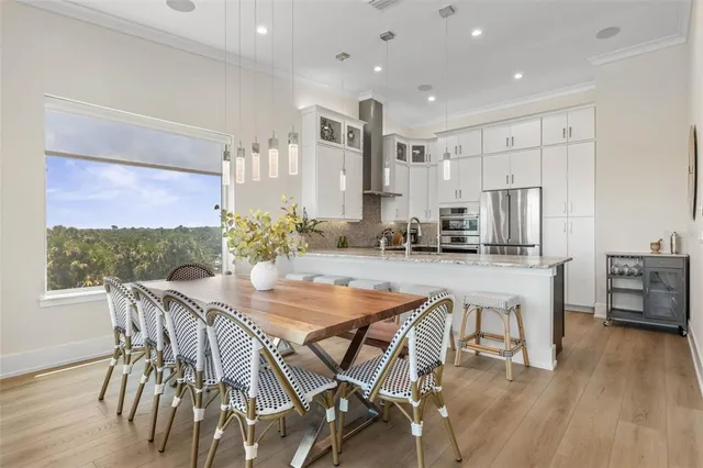 a bedroom with a bed window and a flat screen tv