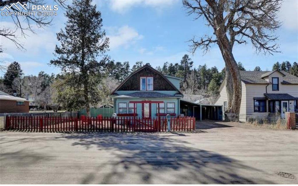 24119 Eccles Street Elbert, CO 80106 - Photo 1 of 23 a view of a house with wooden deck and a floor to ceiling window