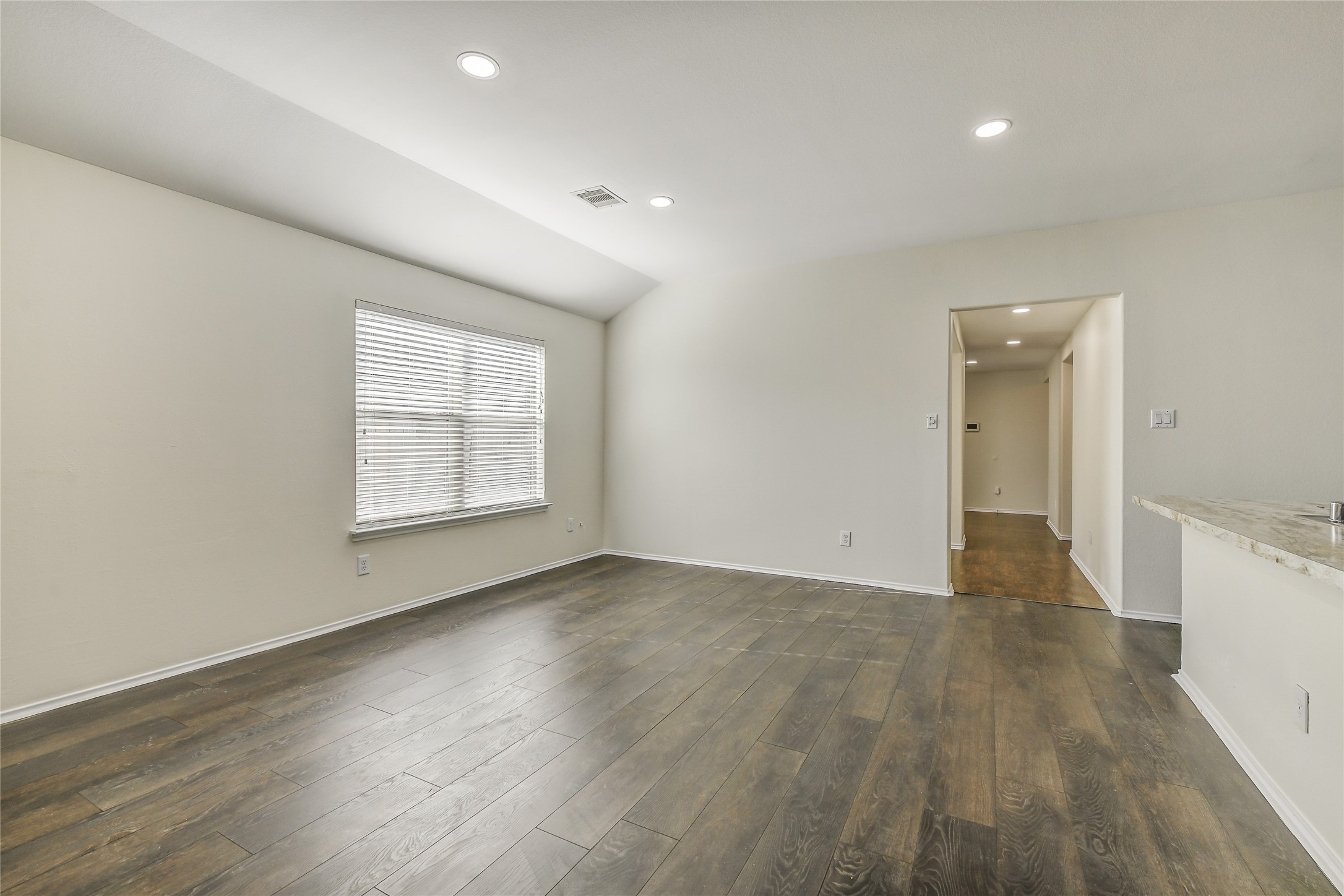 2023 Louetta Mist Drive Spring, TX 77388 - Photo 19 of 39 an empty room with wooden floor and windows