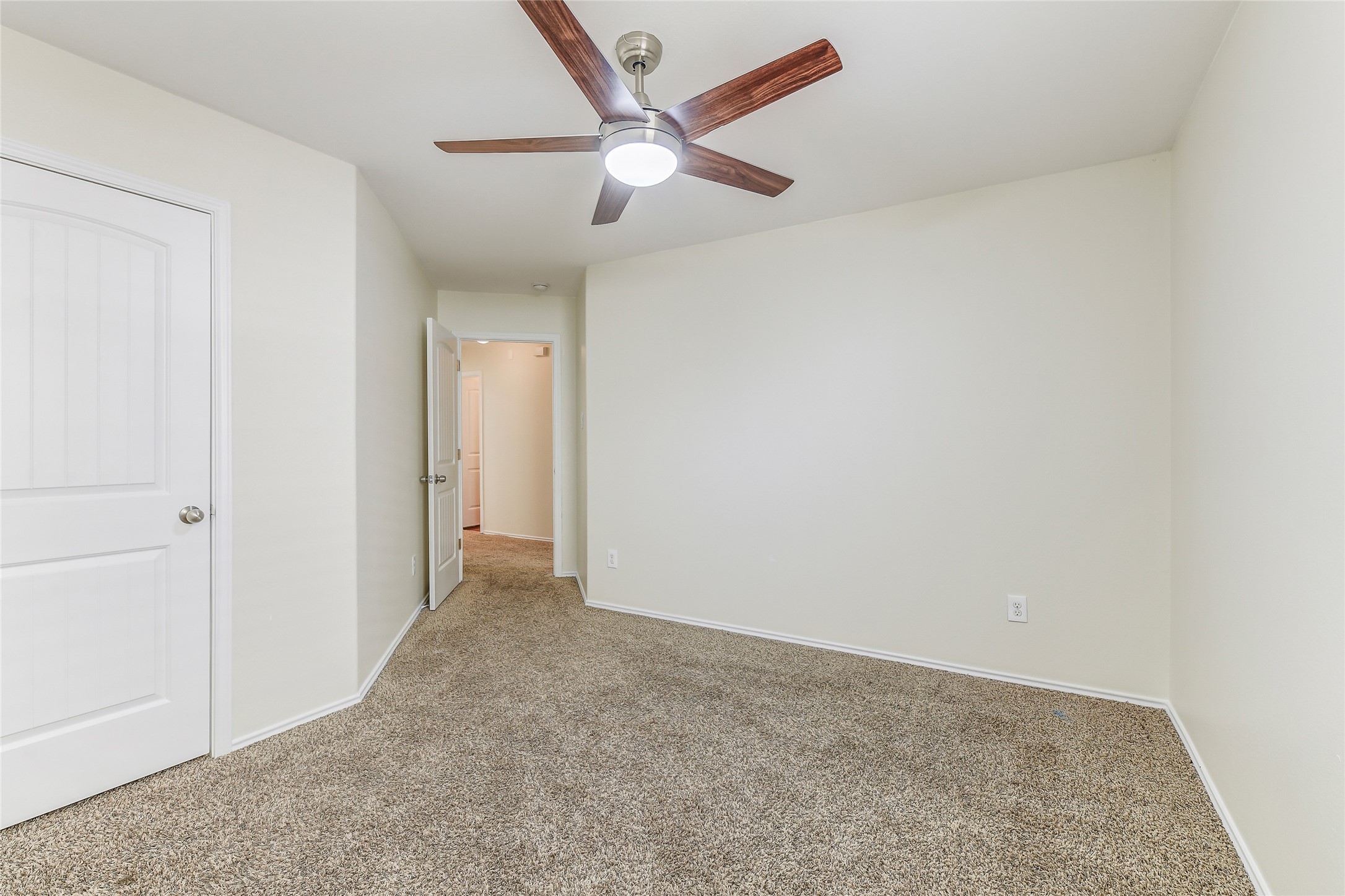 2023 Louetta Mist Drive Spring, TX 77388 - Photo 35 of 39 an empty room with closet and fan