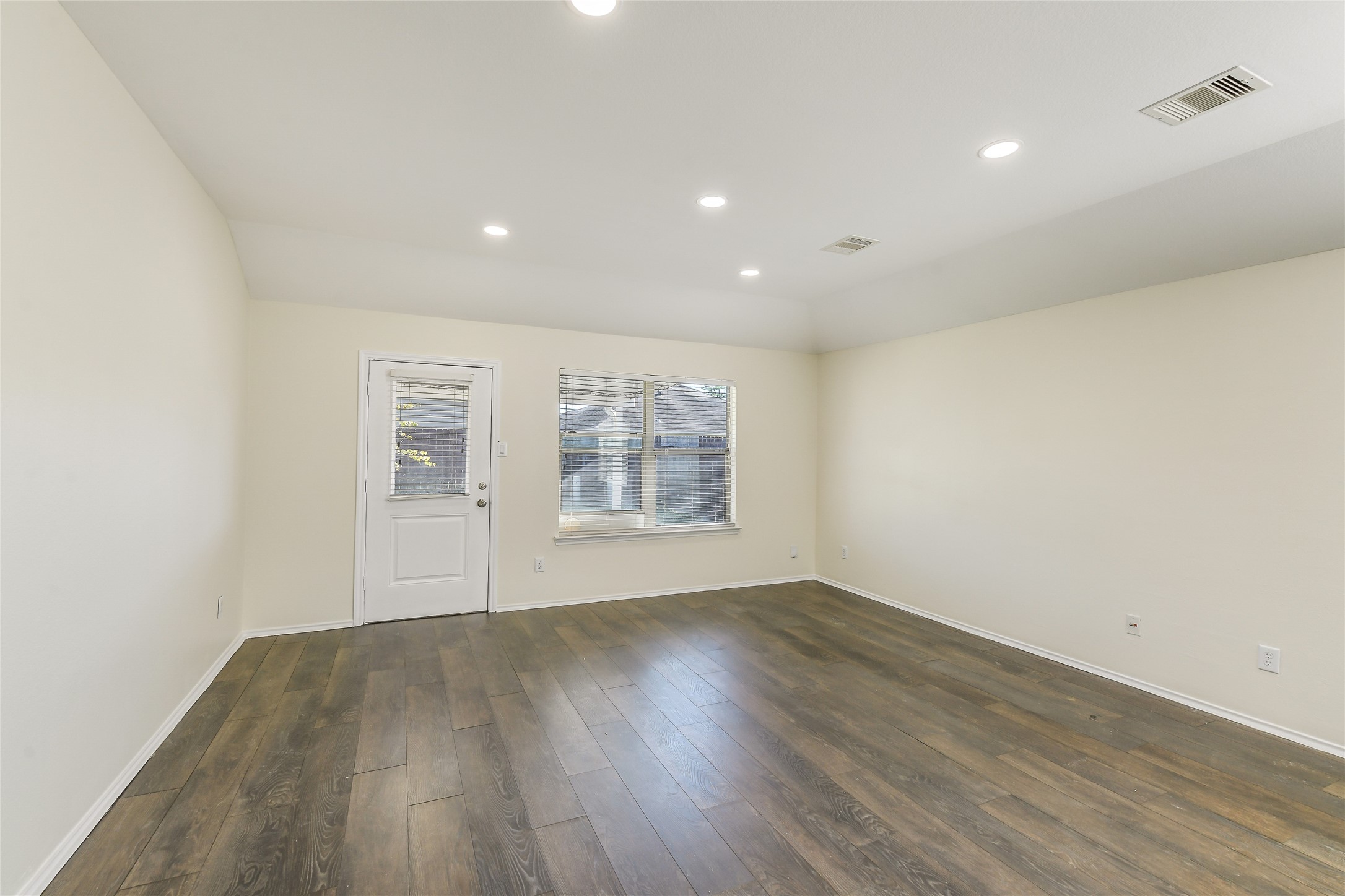 2023 Louetta Mist Drive Spring, TX 77388 - Photo 9 of 39 an empty room with wooden floor and windows