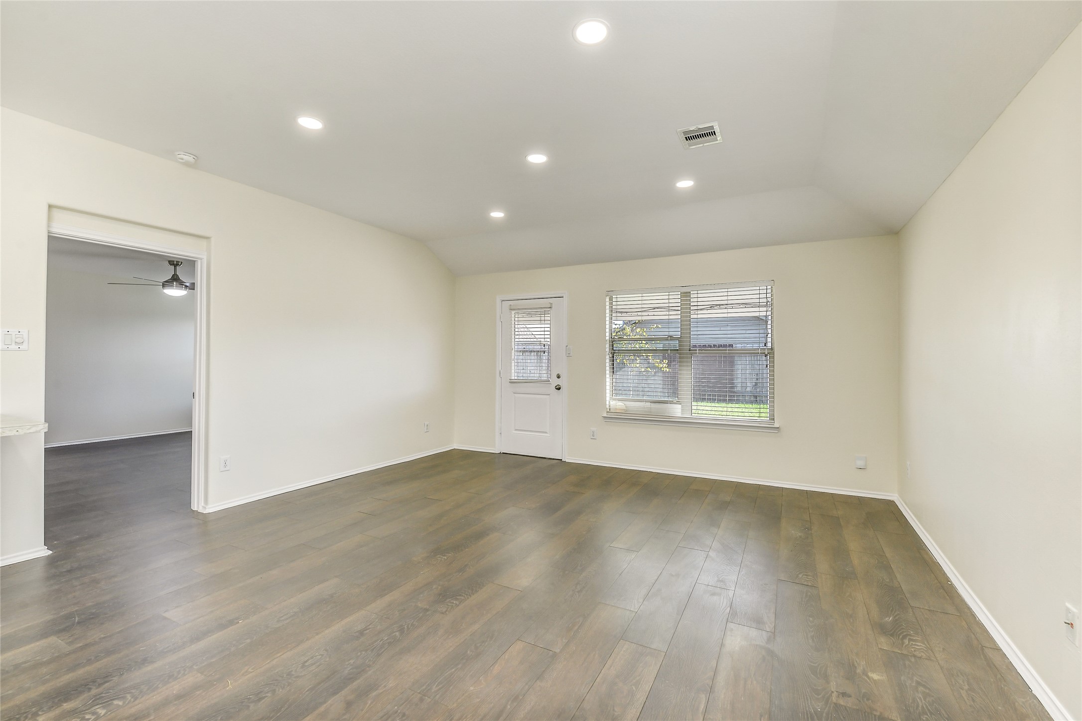 2023 Louetta Mist Drive Spring, TX 77388 - Photo 10 of 39 an empty room with wooden floor and windows